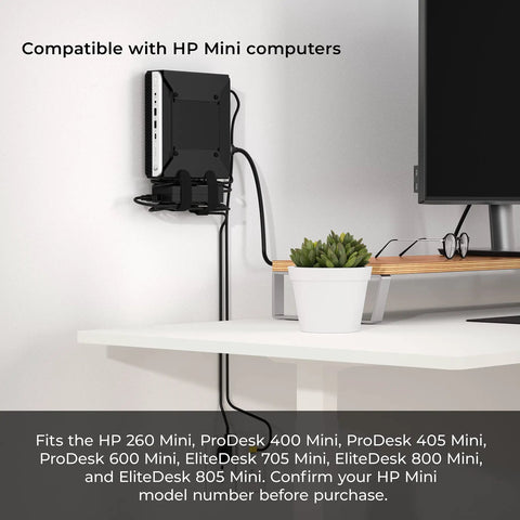 Rock Solid Vesa Mount Bracket For HP Desktop Mini Prodesk And EliteDesk Rigs Slick Easy Install mounted on wall behind a monitor.