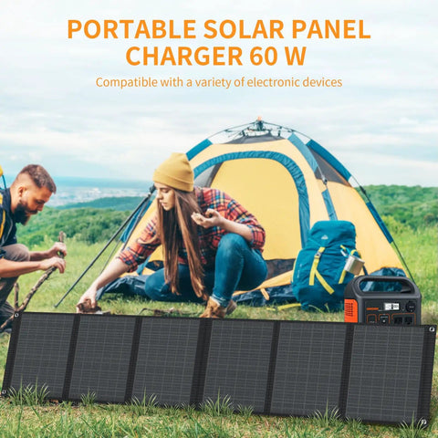 Portable 60W Foldable Solar Panel for Camping on the Go, setup beside a tent, powers cell phones and tablets with 5V USB and 18V DC