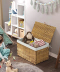 Large Handwoven Foldable Storage Basket Metal Frame Real Deal with Lid and Grippy Handles Cotton Lined Bin for Bedroom Laundry Gray Top Shelf Versatile Organizer filled with toys in a child's playroom.
