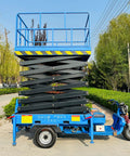 Heavy Duty Electric Hydraulic Scissor Lift Platform With 1000 Kg Capacity mobile platform in blue, showcasing elevated work area.