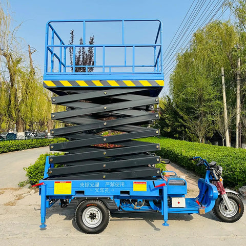 Heavy Duty Electric Hydraulic Scissor Lift Platform With 1000 Kg Capacity mobile platform in blue, showcasing elevated work area.