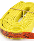 Heavy Duty Rock Solid 1 Inch By 16 Foot Nylon Lifting Sling Built Different For Industrial Rigging visible in yellow with warning label.