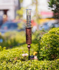 Solar Powered Rain Gauge With LED Night Light Outdoor Garden Stake Decoration 7 Inch Plastic Tube in garden setting