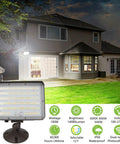 Dusk To Dawn Outdoor 100W LED Flood Light With Knuckle Mount illuminating a residential area with 14000 lumens