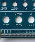 Holistic Drill Bit Gauge, blue 3-in-1 tool showing fractional inch and millimeter sizes with a bolt across the scale