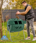 Man using Dual Chamber 43 Gallon Outdoor Compost Tumbler With Sliding Doors And Included Gloves, Rotating Bin For Batch Composting