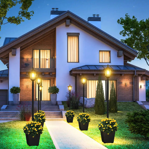64 Inch Solar Lamp Post With Planter For Garden And Pathway illuminating a modern house entrance with warm white glow