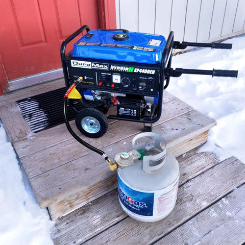 GasSaf 3ft two-stage propane regulator with hose attached to a propane tank feeding a blue DuroMax portable generator.