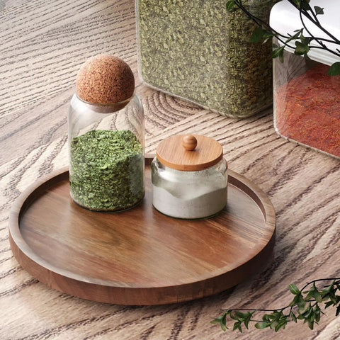 Acacia Wood Lazy Susan Turntable Organizer for Kitchen Cabinets and Pantry with spices on wood countertop, small size.