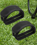 2 Pack Bike Pedal Straps Toe Clips Straps Adjustable Anti Slip Cycling Foot Straps For Kids And Adults Durable Nylon With Reinforced Stitching Easy To Install Comfortable Fit Great For Leisure Or High Intensity Rides on grass next to a bike wheel