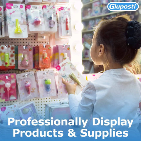 Child browsing a variety of packaged products on a pegboard display in a retail store.