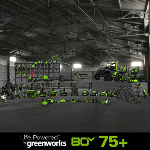 80V Brushless Cordless Chainsaw With 18 Inch Bar And Smart Auto Oiler Built For No Sweat Backyard Cleanup And Quick Branch Trimming Featuring Rapid Snap Tension Dial And Slick Gas Free Cutting Action For Serious Yard Maintenance Jobs displayed among various greenworks tools in a warehouse.