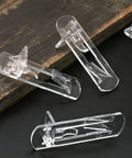 Heavy Duty Clear Shelf Support Pegs With Self Locking Grip For 5/16 Inch Holes And 19/32 Inch Thick Shelves Rock Solid 50 Pack on wooden background