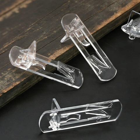 Heavy Duty Clear Shelf Support Pegs With Self Locking Grip For 5/16 Inch Holes And 19/32 Inch Thick Shelves Rock Solid 50 Pack on wooden background
