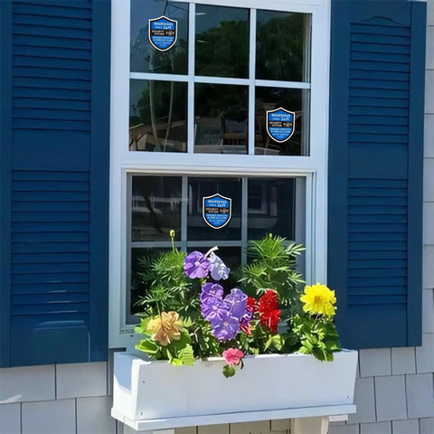 3 Pack Home Security Alarm Signs Weatherproof Self Adhesive 24 Hour Warning Stickers on blue-framed window.