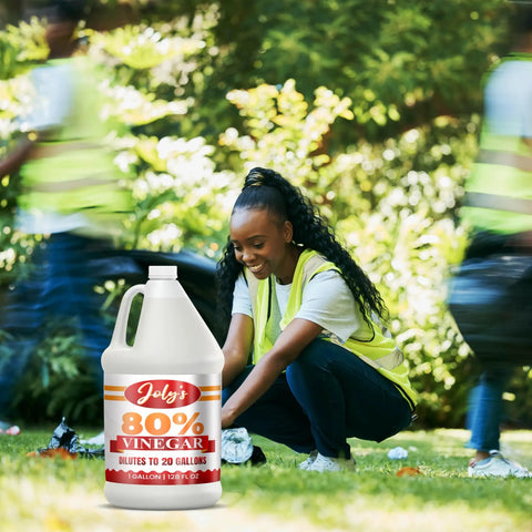 Heavy Duty Industrial Strength Vinegar Concentrate With Eighty Percent Acetic Acid For Tough Cleaning At Home And Outdoor Jobs Dilutes Easily Technical Grade Safe For Septic Systems 128 Ounce Bottle shown in a garden setting with a person cleaning nearby.