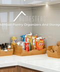 Stackable Bamboo Pantry Storage Bins Featuring Smooth Pull Out Trays for organizing snacks and spices on kitchen counter.