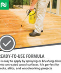 Person applying Penetrating Wood Preservative And Termiticide For Termites Carpenter Ants And Wood Boring Beetles on deck