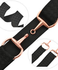Close-up of black 1.5 Inch Equestrian Elastic Belt with snaffle bit buckle and surcingle clasps for horseback riding