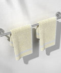Brushed Nickel 24 Inch Towel Bar Wall Mounted Stainless Steel Bath Rack with two beige towels hanging