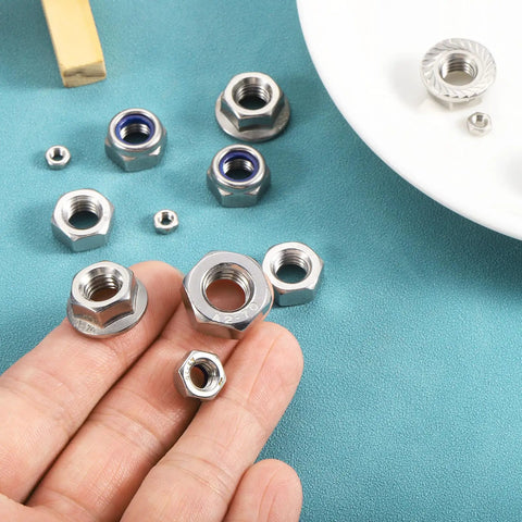 Close-up of Rock Solid Left Hand Reverse Nuts M8x1.25mm 304 Stainless Steel Serrated Flange Hardware in hand, five pack.