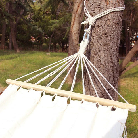 Tree Swing Straps And Hammock Rope Kit, 13 Ft Each With Heavy Duty Carabiner Hooks attached to a tree, outdoors