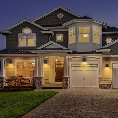 Two Pack Black LED Outdoor Wall Lights for Porch and Patio, Weatherproof Exterior Sconces on modern house facade at dusk
