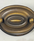 Close-up of Oval Dresser Pulls Set, Two And A Quarter Inch Center To Center, Antique English Finish, Vintage Style Cabinet Hardware