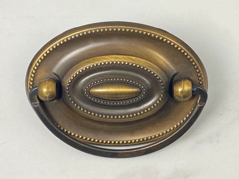 Close-up of Oval Dresser Pulls Set, Two And A Quarter Inch Center To Center, Antique English Finish, Vintage Style Cabinet Hardware