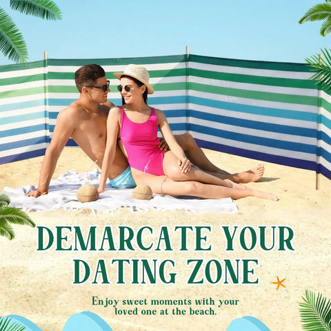 Couple at beach with 20 Ft Stripe Beach Windscreen Set With Six Hardwood Poles Rubber Mallet And Carry Bag Portable Sand Wind Blocker