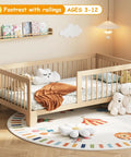 Low Profile Twin Floor Bed With Quick Release Guardrails And Sturdy Wood Frame For Zero Fuss Independent Rest and toy decor in bright nursery.