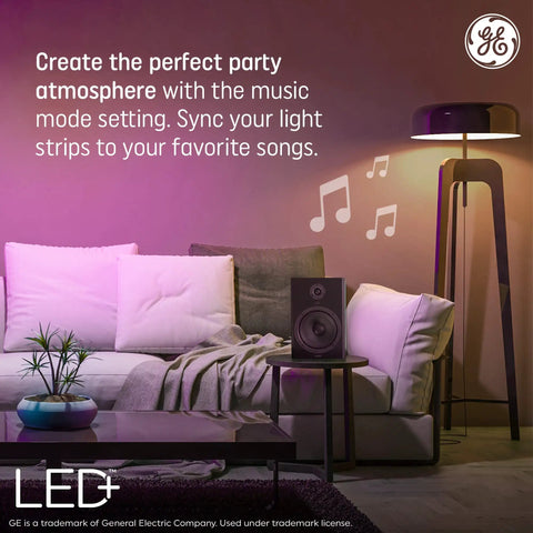 Color Changing LED Light Strip With Remote 32 Feet Of Lit Mood Lighting illuminating modern living room with music sync feature.
