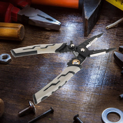 Pretyzoom 7-In-1 Cable Stripper And Crimper For Electricians shown on a workbench with a focus on its carbon steel construction and ergonomic design.