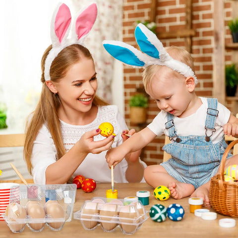 Mother and child decorating eggs with 24 Pack Clear Plastic Egg Cartons With 6 Egg Capacity Per Tray on the table