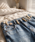 Ditch Tailor Bills And Snag These Pearl Pin Style Waist Tightening Clips For Jeans Dresses And Sweaters with pearl and floral designs on denim.