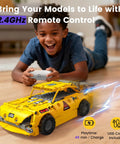 Child playing with 5 In 1 STEM RC Robotics Kit With App And Remote Control, Build Mech Robot Wall Robot Sports Car Tunneling Robot And Engineering Grader