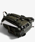 Large Customizable Camera Backpack For Pro Photographers With 16 Inch Laptop Pocket And Exterior Tripod Straps in olive green.