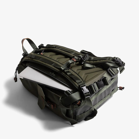 Large Customizable Camera Backpack For Pro Photographers With 16 Inch Laptop Pocket And Exterior Tripod Straps in olive green.
