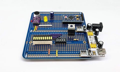 Large Gold Plated Solderable Breadboard Prototype Kit For DIY Electronics Projects Compatible With Arduino Nano ESP8266 NodeMCU 6 Pack Blue showing components on blue board