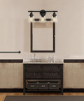 Three-Light Vanity Fixture In Oil Rubbed Bronze With Clear Glass Shades For Over-Mirror Bathroom setup