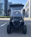 Hella Comfy 6 Seater Electric Golf Cart With Roof LED Light Bar sleek black design and headlights parked on a road.
