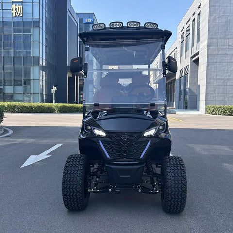 Hella Comfy 6 Seater Electric Golf Cart With Roof LED Light Bar sleek black design and headlights parked on a road.