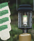 10 Pack U Shaped Lantern Mantles for Propane Lamps next to lit gas lantern, showing mantle installation and outdoor use