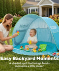 Baby in pop-up baby beach tent with UPF 50 UV protection, portable shade pool, dual mesh panels, outdoor lawn setting.