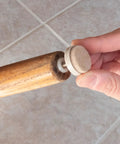 Attaching 1-inch threaded felt furniture glide to chair leg on tile floor, part of 4 pack 1 inch threaded felt furniture glides with one quarter inch adjustable leveling feet for wood tile laminate floors tan includes threaded inserts tough build for heavy use and quiet smooth glide on all floor surfaces.