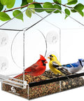 Window Bird Feeder With Ultra Strong Suction Cups For Easy Backyard Birding Clear Acrylic Body With Drain Holes And Removable Tray Large Seed Capacity displayed with birds feeding, mounted with suction cups on a window.