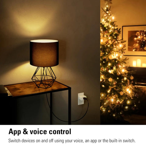 Matter Over Thread Smart Plug Pack With App And Voice Control in wall socket near lamp and Christmas tree.