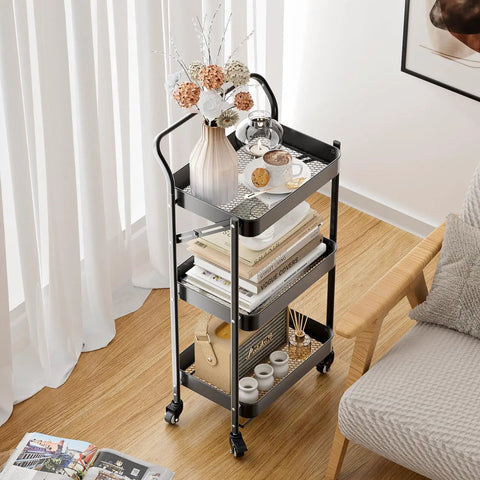 No Tools Needed Foldable Rolling Cart With Three Tiers In Black Metal Finish, Easy Unfold And Lock Setup, Heavy Duty Mobile Storage Organizer On Wheels For Office Garage Tools Kitchen And More shown in living room next to couch.
