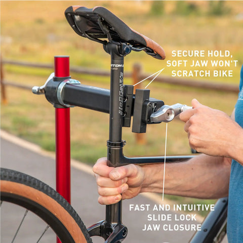 Ultralight Pro Bike Repair Stand secure clamp holding bike seat post with fast slide lock feature, red