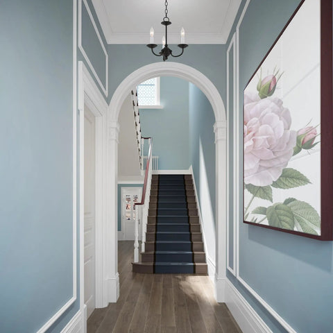 Three Light Black Mini Chandelier With Transitional Steel Design in elegant hallway, blue walls, floral artwork